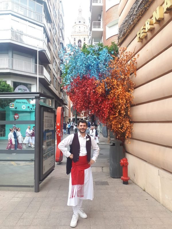 Héctor wearing the traditional huertano outfit in the streets of Murcia